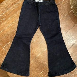 Dark jean bell bottoms with elastic waist.